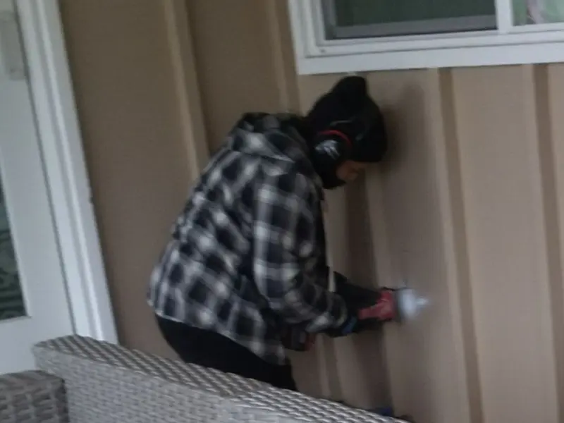 Professional electrician installing an exterior outlet in Niles