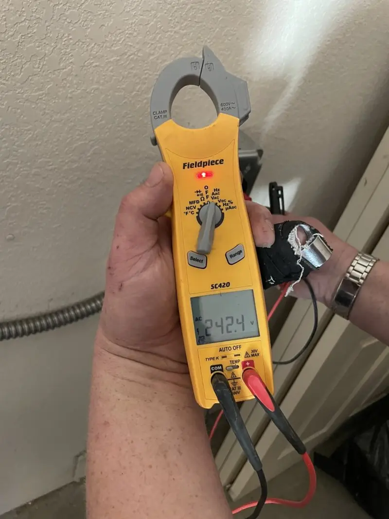 Voltage testing with clamp meter during Electrical Installation Services in Niles